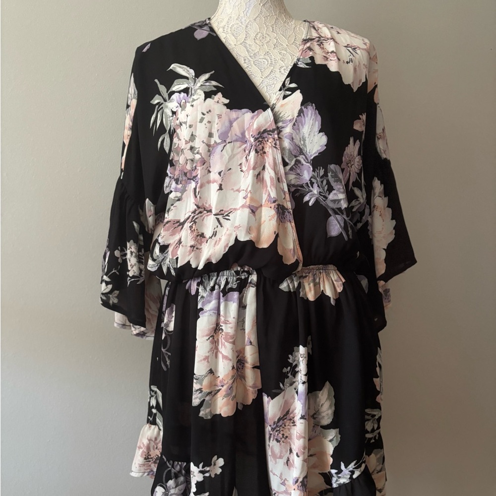 Floral black and cream with hints of pink in the floral pattern shorts Romper